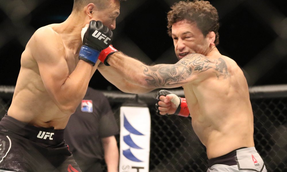 Dec 21, 2019; Busan, SOUTH KOREA; Chan Sung Jung (blue gloves) fights Frankie Edgar (red gloves) during UFC Fight Night at Sajik Arena. Mandatory Credit: Jasmin Frank-USA TODAY Sports